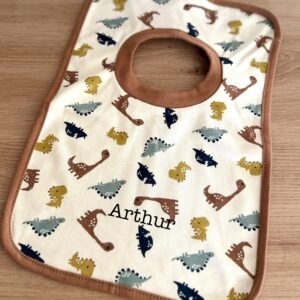 Bavoir à motifs léopard ou dinosaure